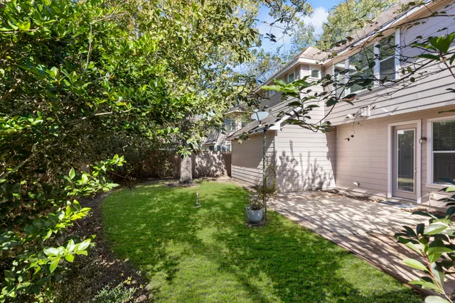 a picture of a room with a white wall and a large window