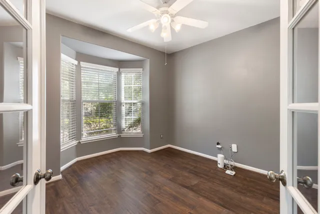 wooden floor and window in an empty room