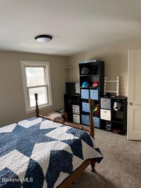 63 Addison Street North Adams, MA 01247 - Photo 12 of 17 a bedroom with a bed window and a television