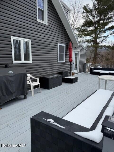63 Addison Street North Adams, MA 01247 - Photo 13 of 17 a view of a patio with table and chairs with wooden floor and fence