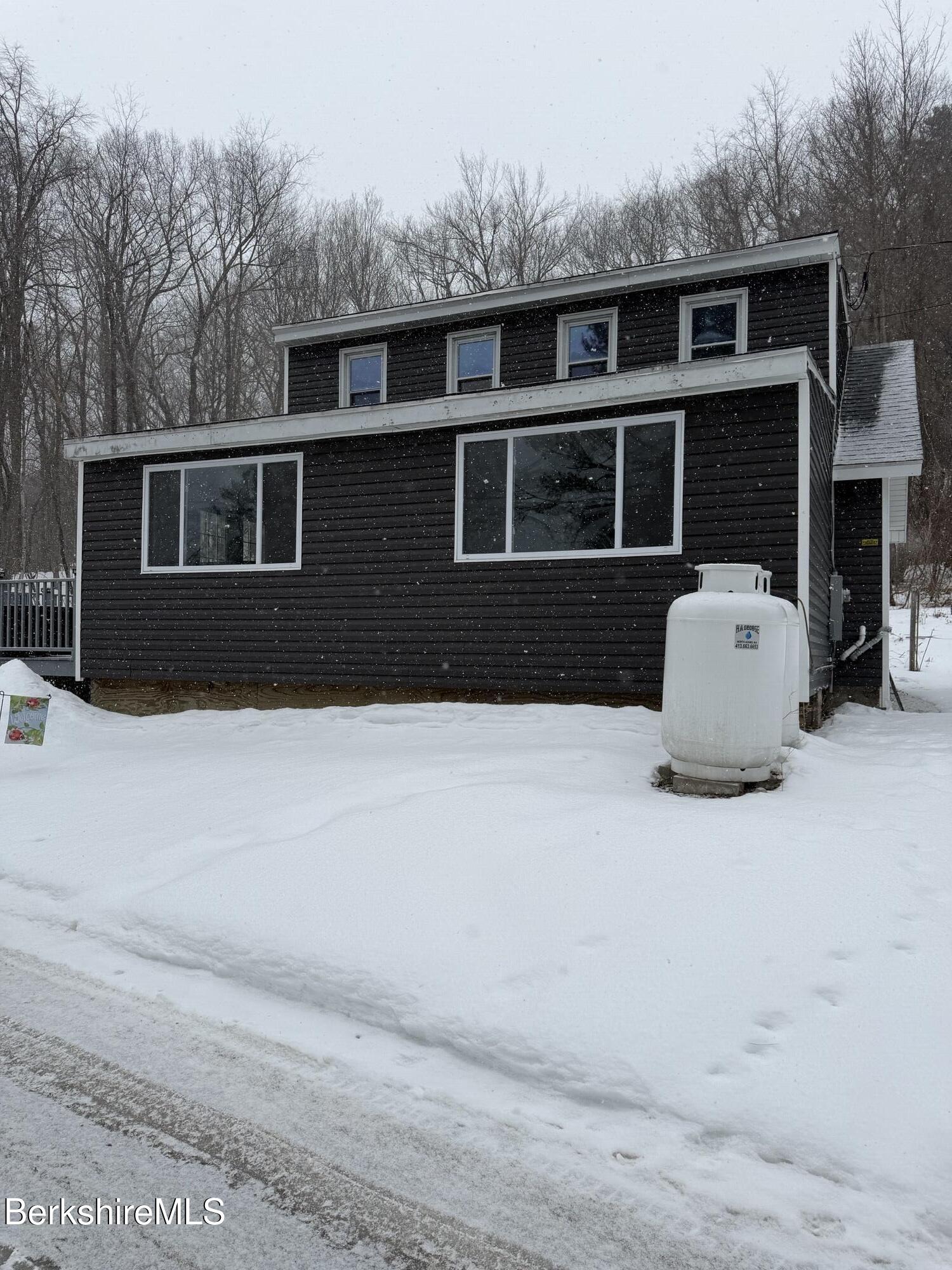 63 Addison Street North Adams, MA 01247 - Photo 16 of 17 a front view of a house with a yard