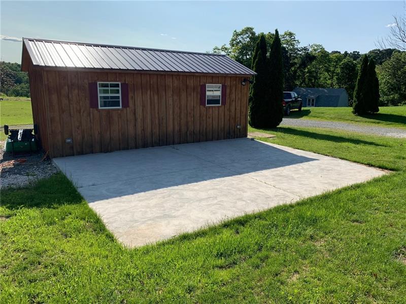 249 Heimann Road Latrobe, PA 15650 - Photo 4 of 25 BACK OF STORAGE SHED / PATIO