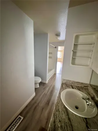 a bathroom with a sink and toilet