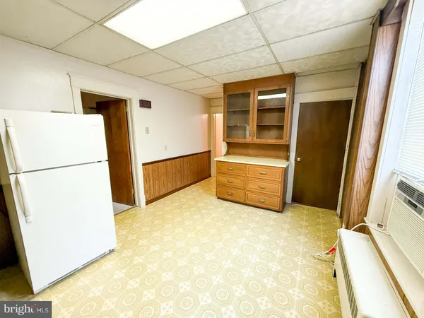 a kitchen with stainless steel appliances a refrigerator sink and cabinets