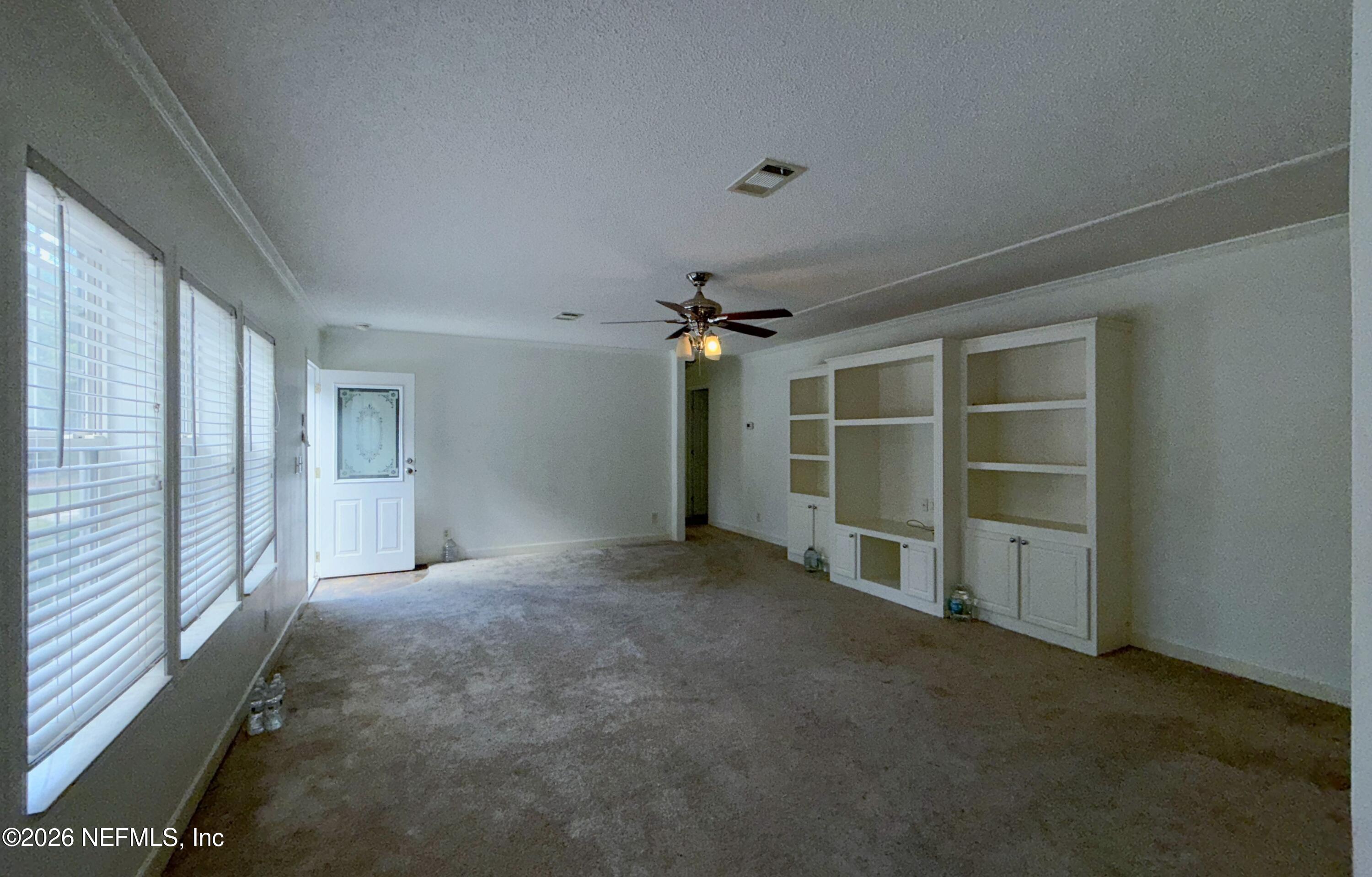 136 Short Pine Road Hawthorne, FL 32640 - Photo 13 of 39 a view of empty room with a ceiling fan
