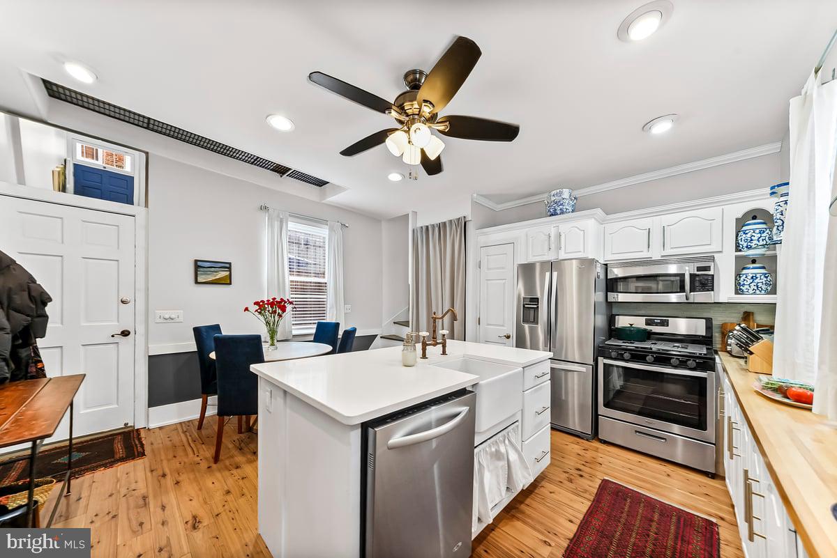 1718 Rodman Street Philadelphia, PA 19146 - Photo 4 of 29 a kitchen with a sink stainless steel appliances and furniture