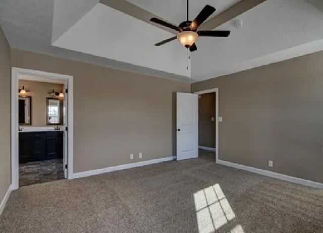 wooden floor in an empty room and a bathroom