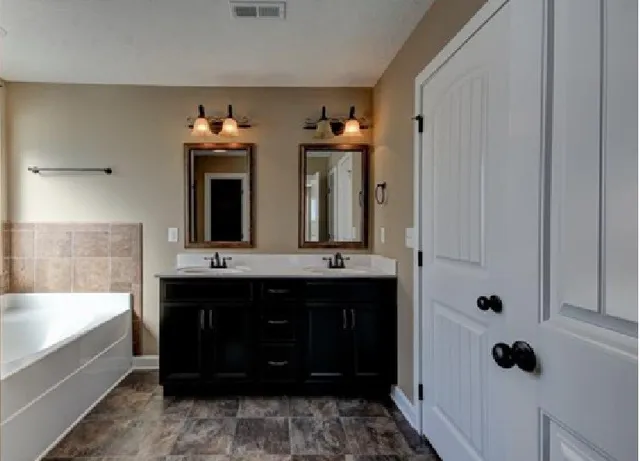 a bathroom with a bathtub and a sink