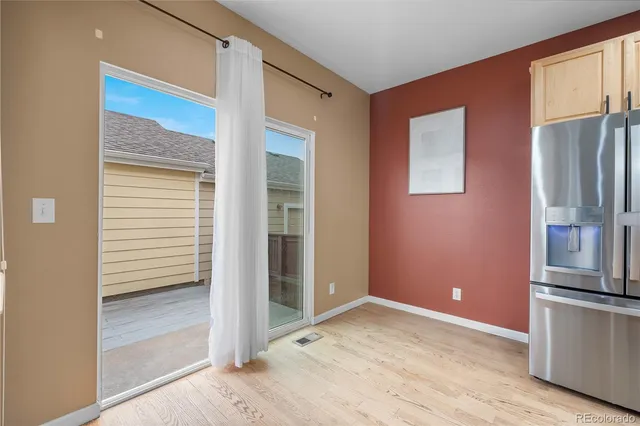 a kitchen with stainless steel appliances granite countertop a stove a sink and white cabinets