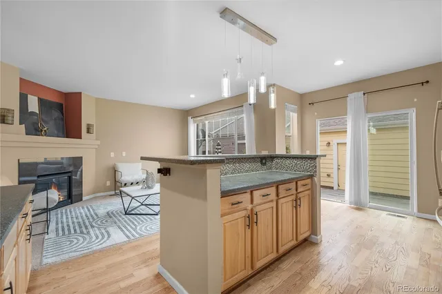 a kitchen with stainless steel appliances granite countertop a refrigerator sink and cabinets