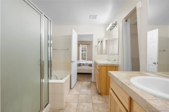 an empty room with a ceiling fan and window