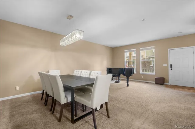 a view of a livingroom with furniture and a table