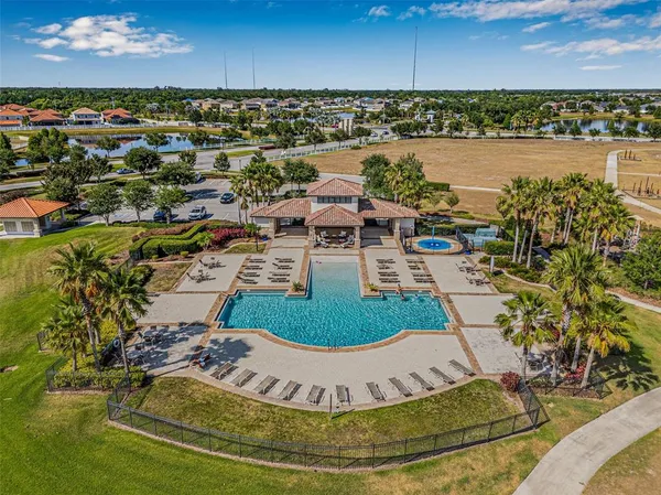 an aerial view of a house with a lake view
