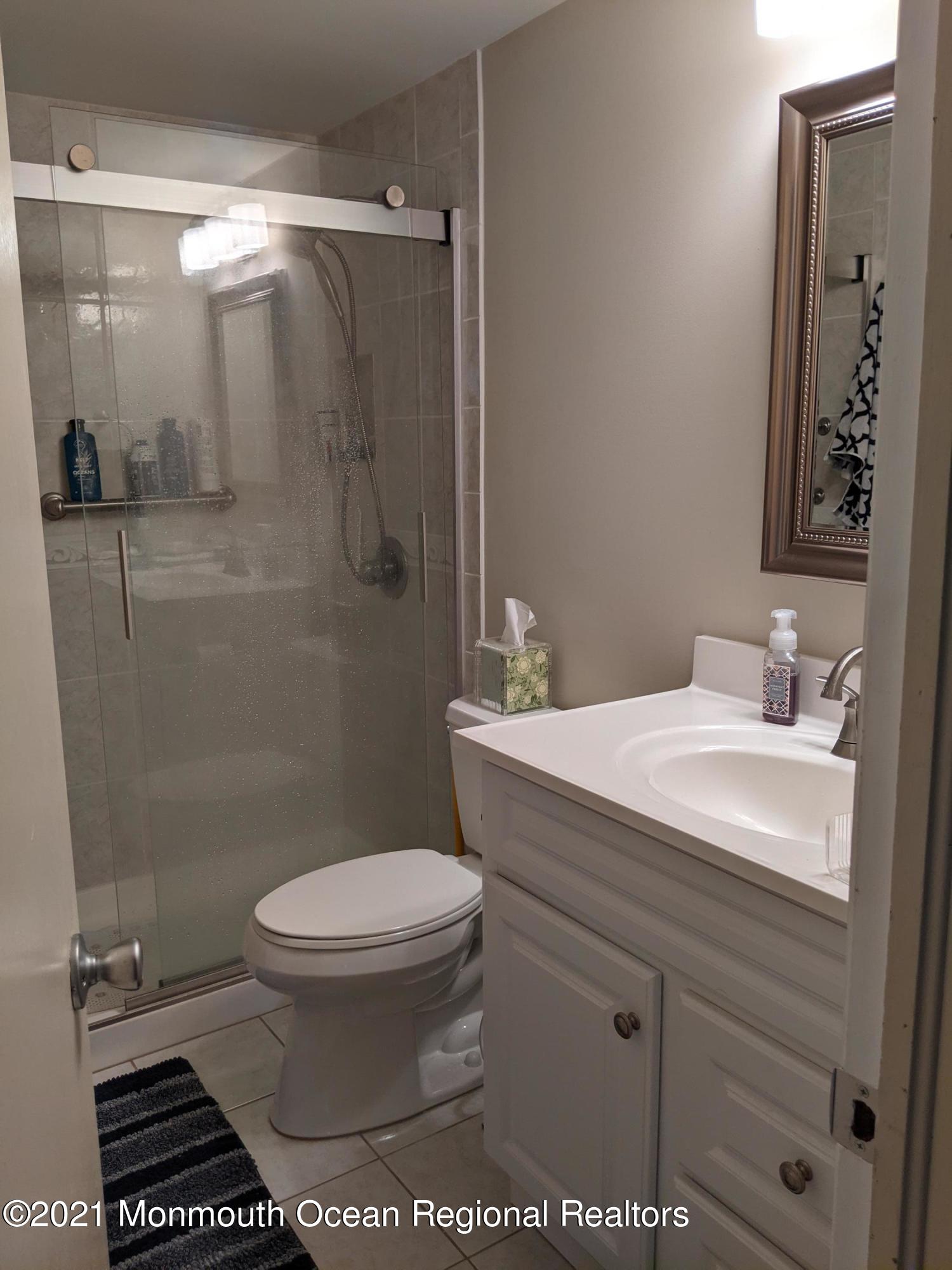 289 Monterey Circle Lavallette, NJ 08735 - Photo 12 of 32 a bathroom with a sink toilet and shower