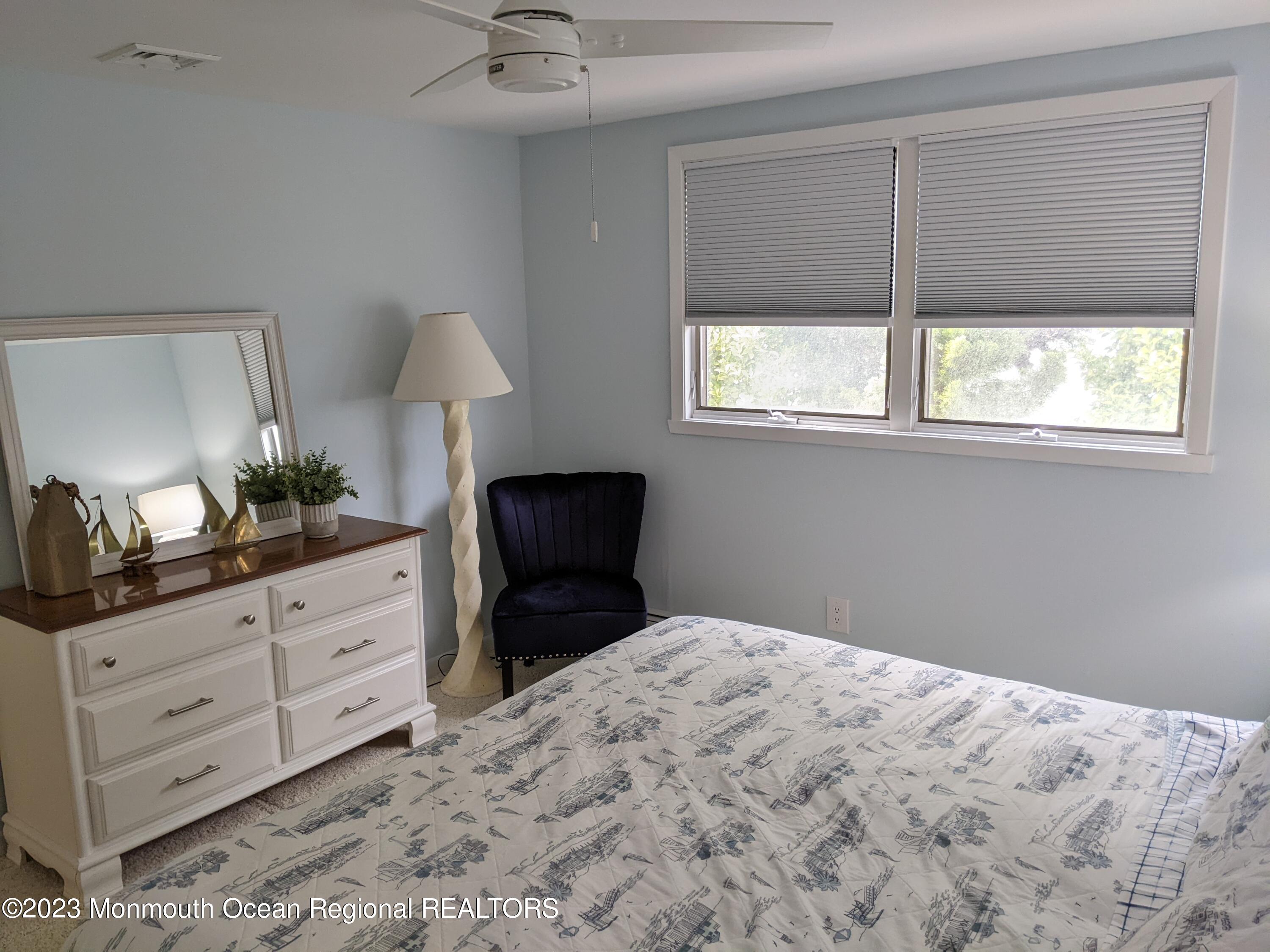 289 Monterey Circle Lavallette, NJ 08735 - Photo 14 of 32 a bedroom with a bed and a dresser