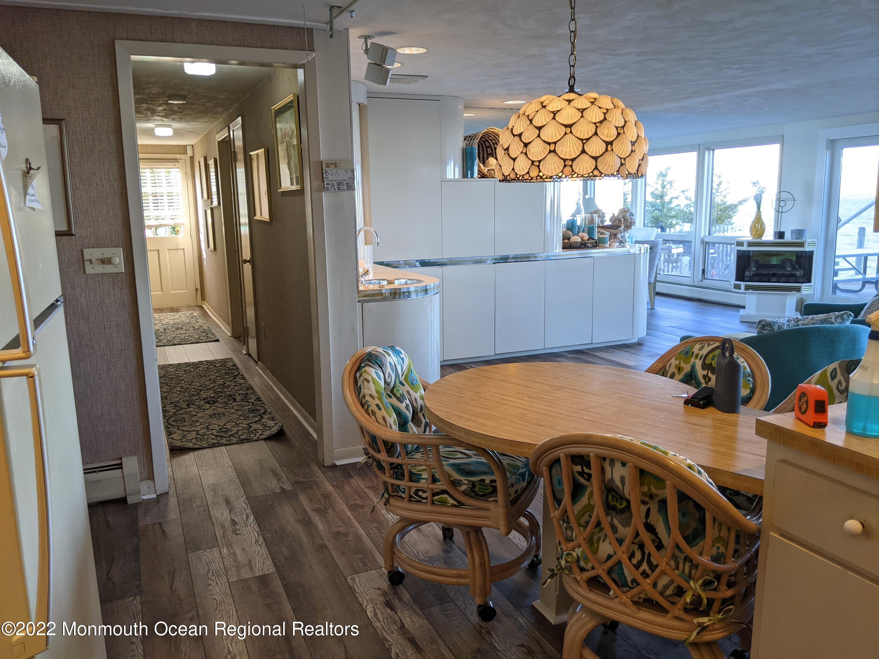 289 Monterey Circle Lavallette, NJ 08735 - Photo 15 of 32 a view of a dining room with furniture and wooden floor