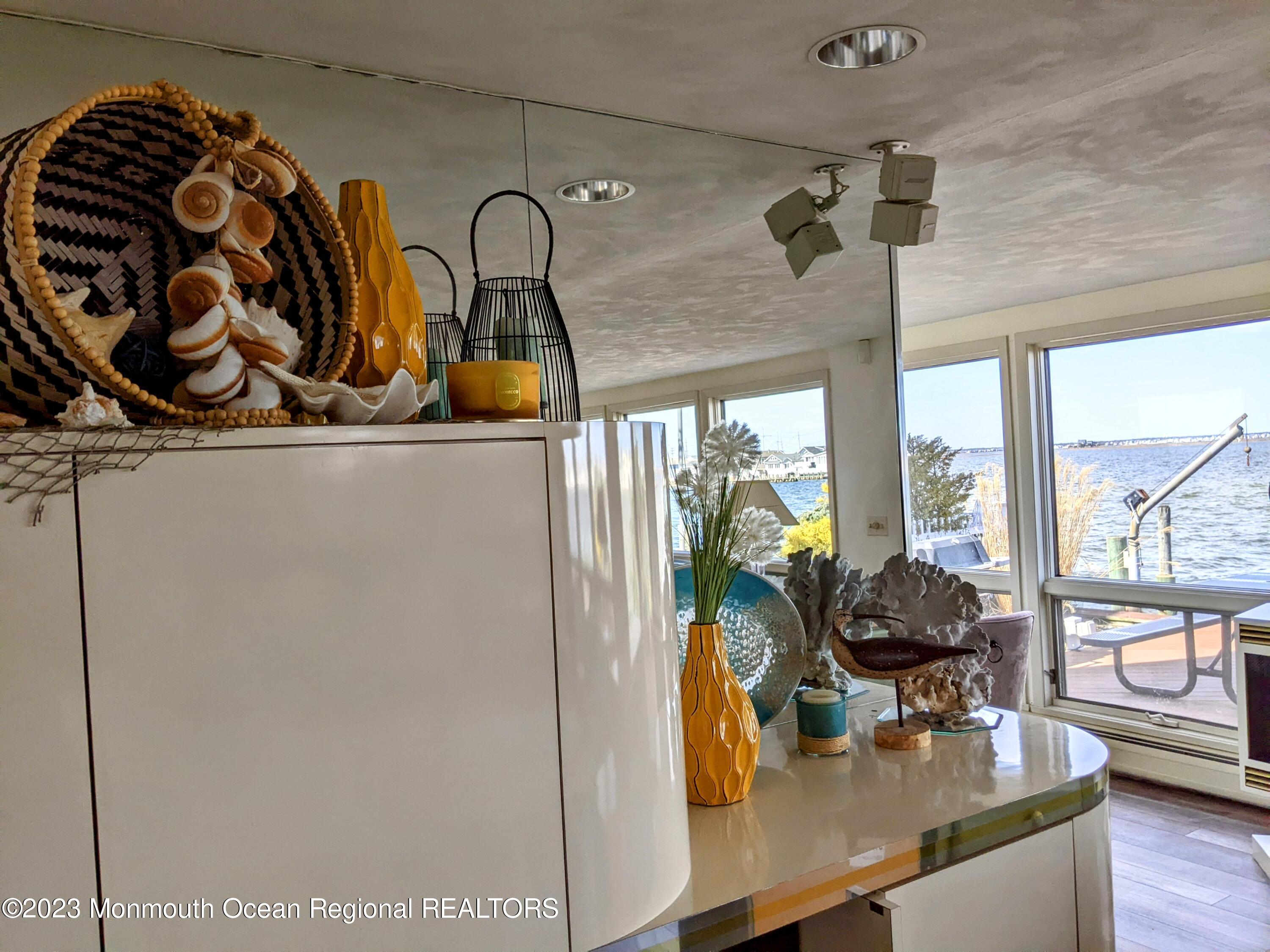 289 Monterey Circle Lavallette, NJ 08735 - Photo 20 of 32 a kitchen with a sink a stove and a window