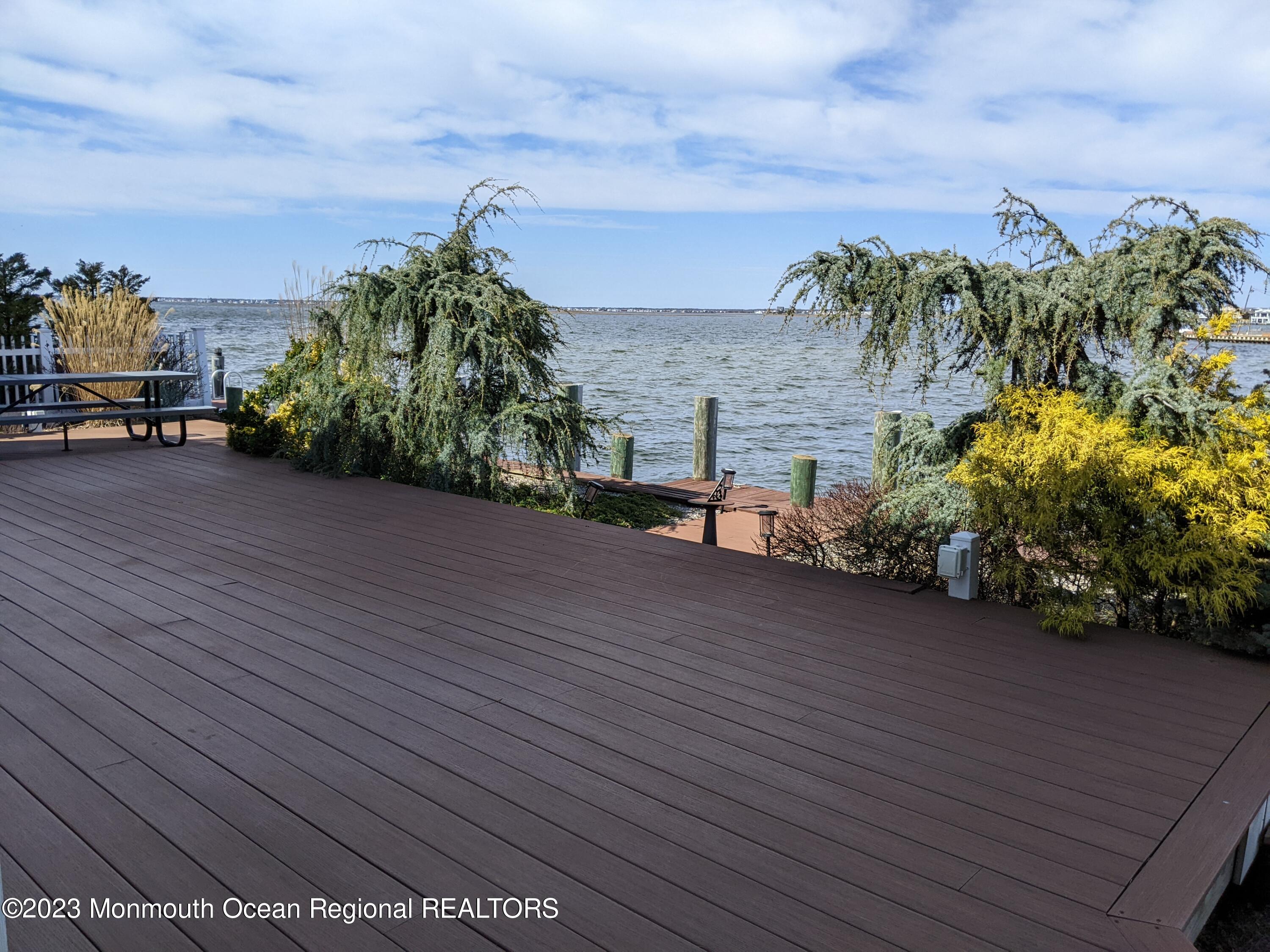 289 Monterey Circle Lavallette, NJ 08735 - Photo 2 of 32 a view of a terrace with a garden