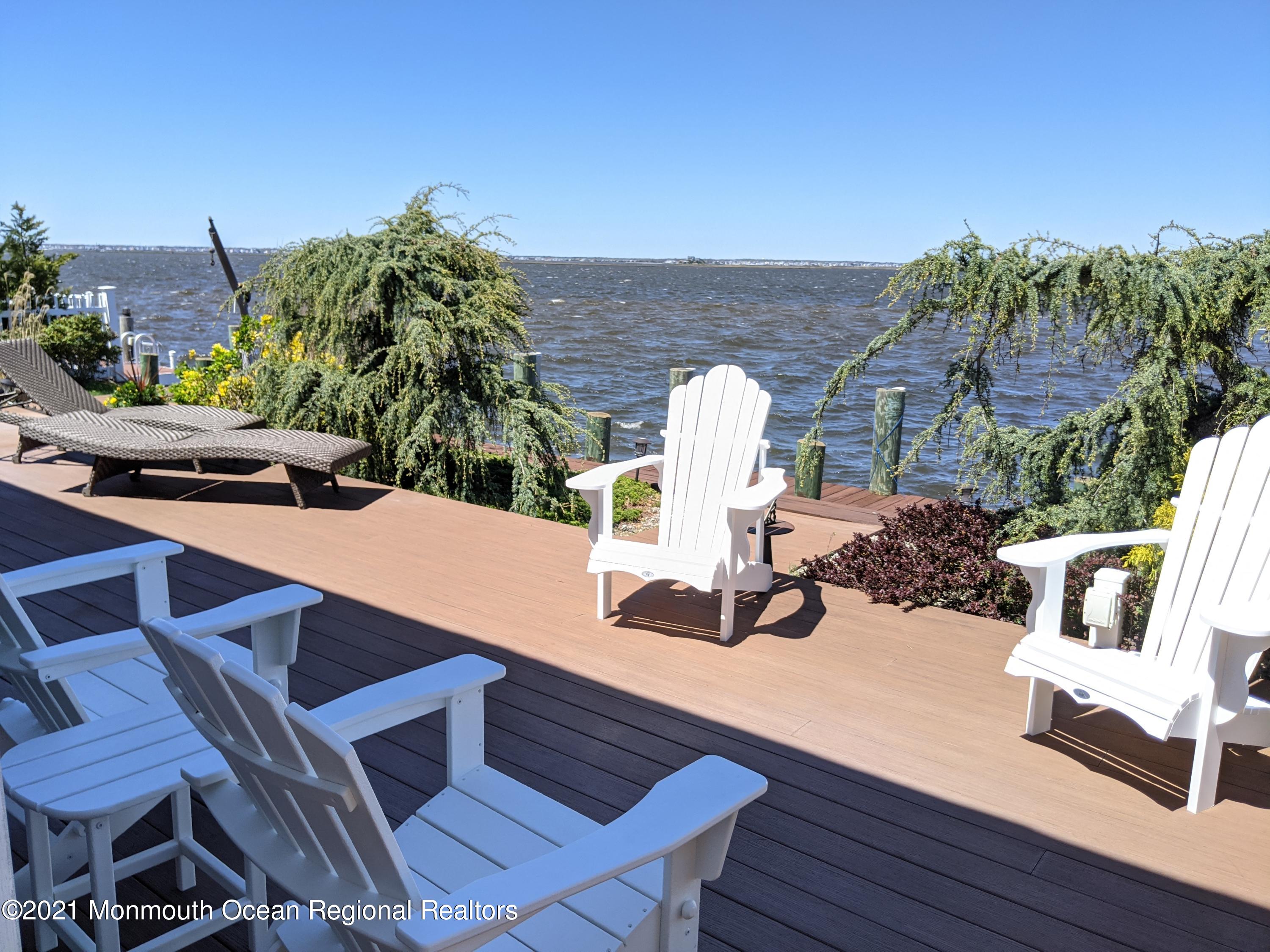 289 Monterey Circle Lavallette, NJ 08735 - Photo 32 of 32 a view of a chairs and table in patio