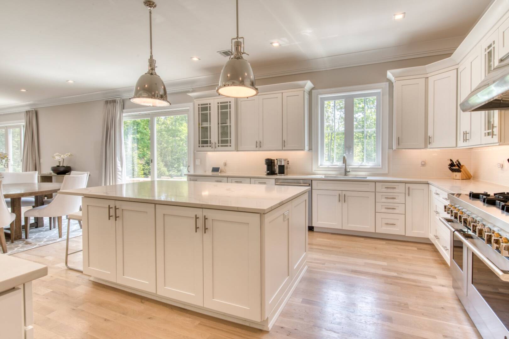 10 Dead Trail Road Water Mill, NY 11976 - Photo 5 of 19 a kitchen with granite countertop white cabinets and window