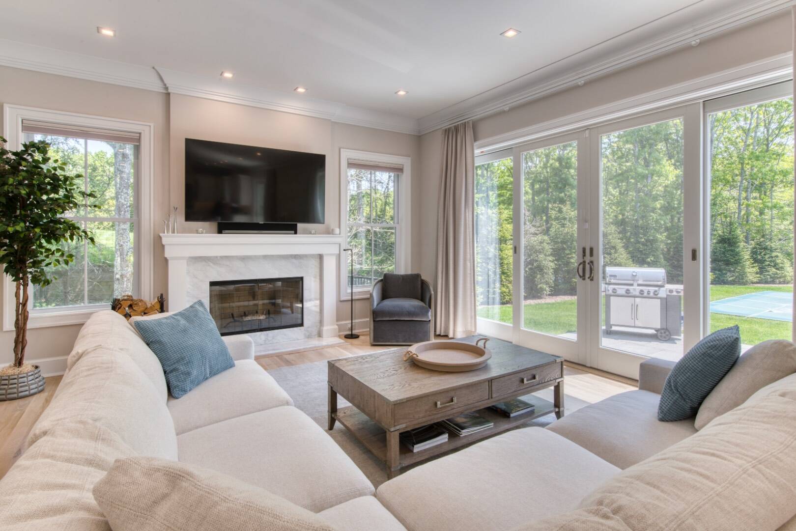 10 Dead Trail Road Water Mill, NY 11976 - Photo 7 of 19 a living room with furniture fireplace and a large window