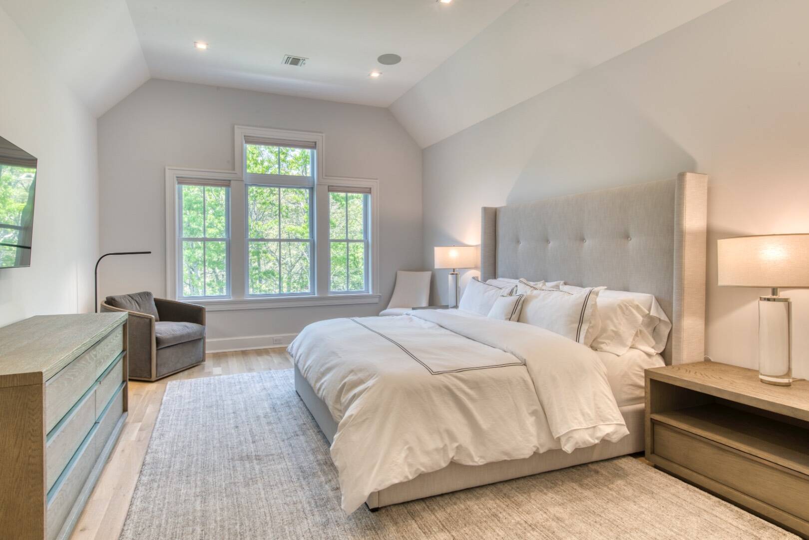 10 Dead Trail Road Water Mill, NY 11976 - Photo 10 of 19 a spacious bedroom with a bed and a large window