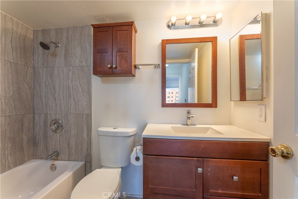 327 Chestnut Avenue, Unit 201 Long Beach, CA 90802 - Photo 15 of 29 a bathroom with a sink toilet tub and shower