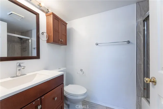 a bathroom with a sink toilet and vanity