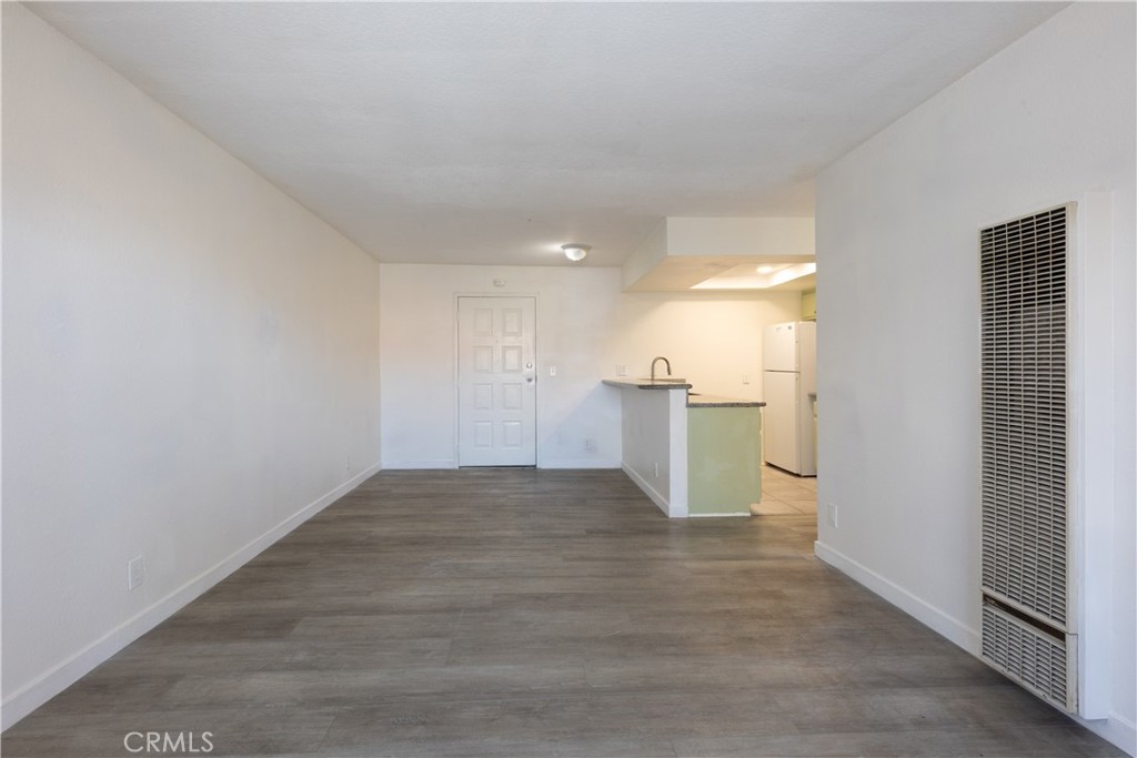 327 Chestnut Avenue, Unit 201 Long Beach, CA 90802 - Photo 5 of 29 a view of a kitchen with a sink and a refrigerator