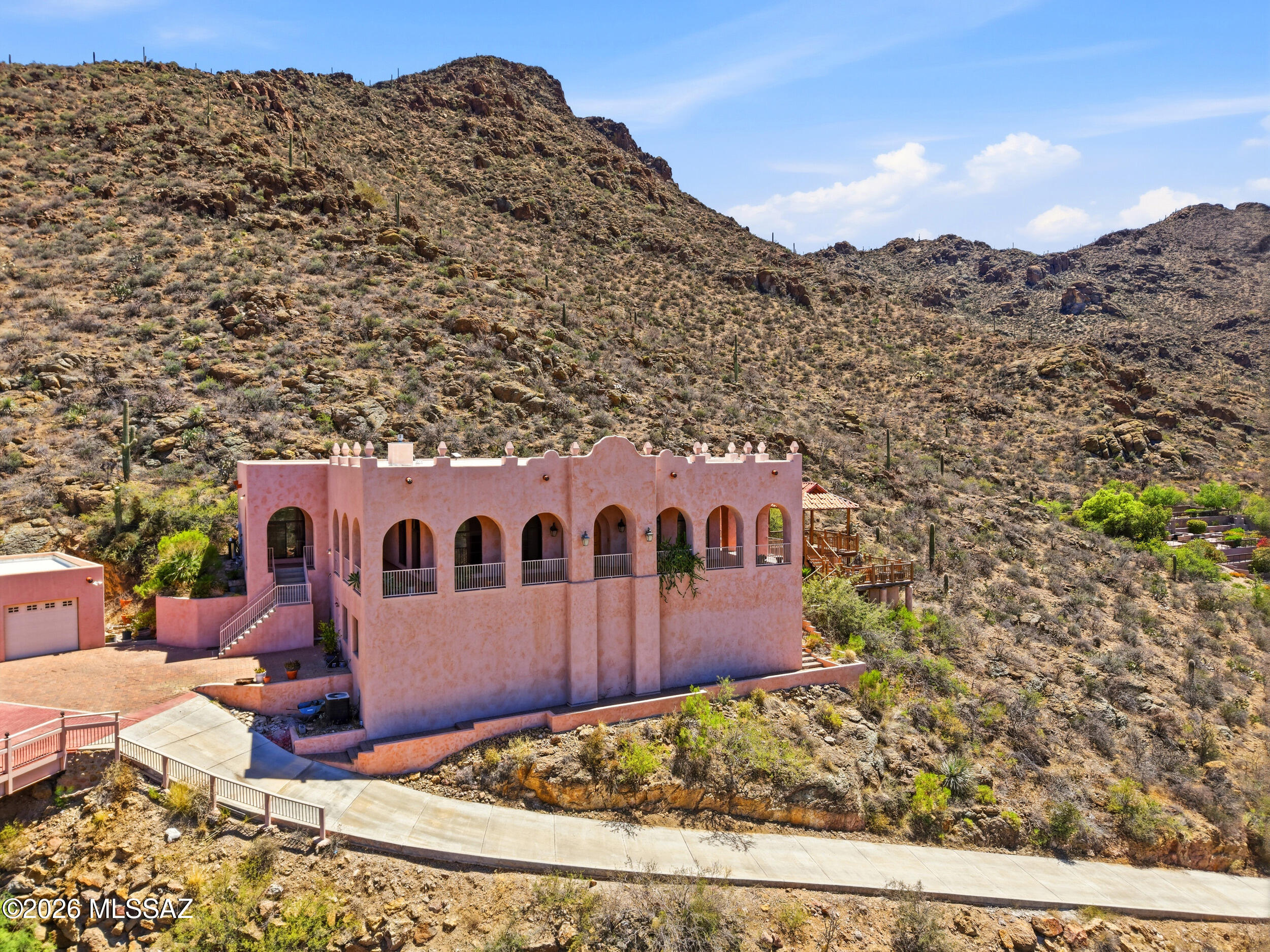 6331 West Trails End Road Tucson, AZ 85745 - Photo 3 of 41 a view of a large building with a mountain in the background