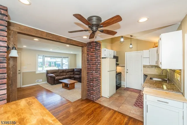 a living room with furniture and a rug