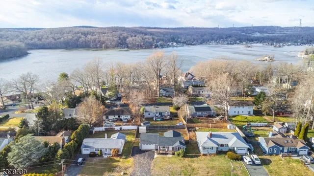 an aerial view of a house with a swimming pool