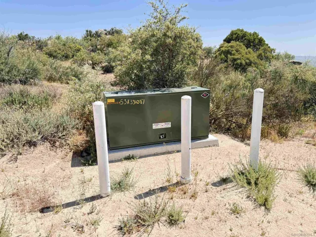 a backyard of a house with a yard covered with snow