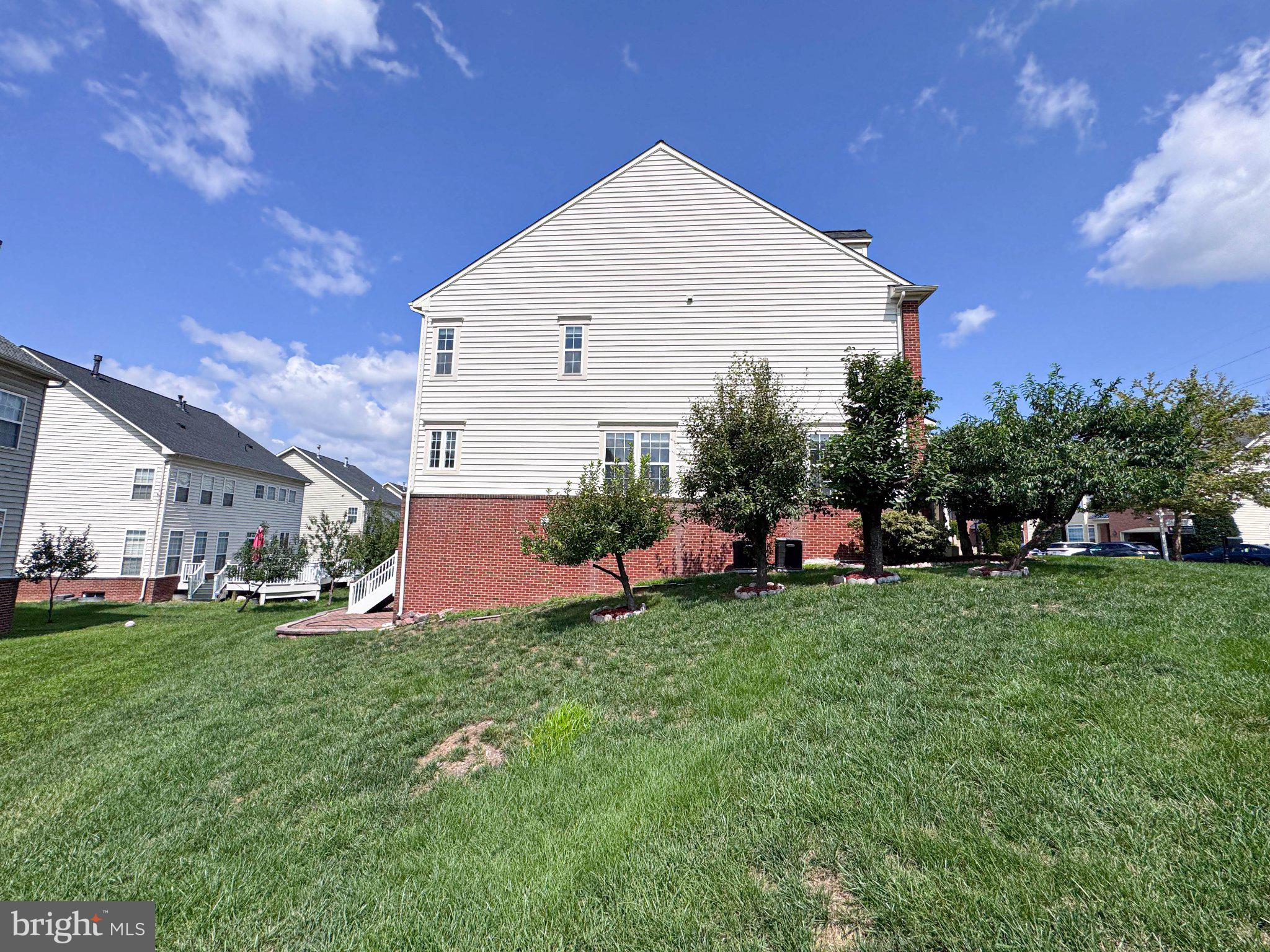 22827 Oakgrove Road Sterling, VA 20166 - Photo 51 of 56 Charming home with lush green yard.