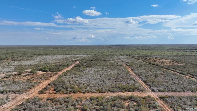 a view of a yard with an ocean