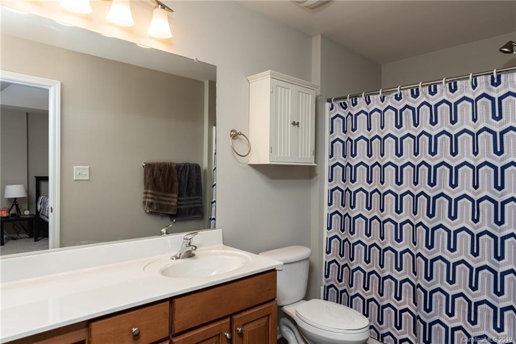 4854 Prosperity Ridge Road Charlotte, NC 28269 - Photo 13 of 22 a bathroom with a sink toilet and shower
