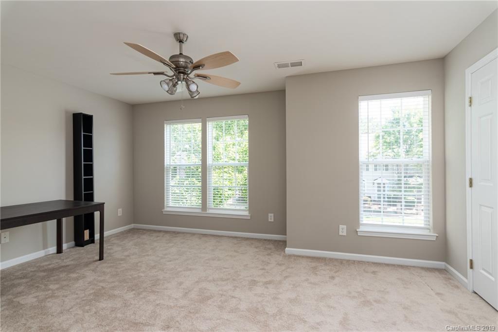 4854 Prosperity Ridge Road Charlotte, NC 28269 - Photo 17 of 22 a view of an empty room with window and a livingroom