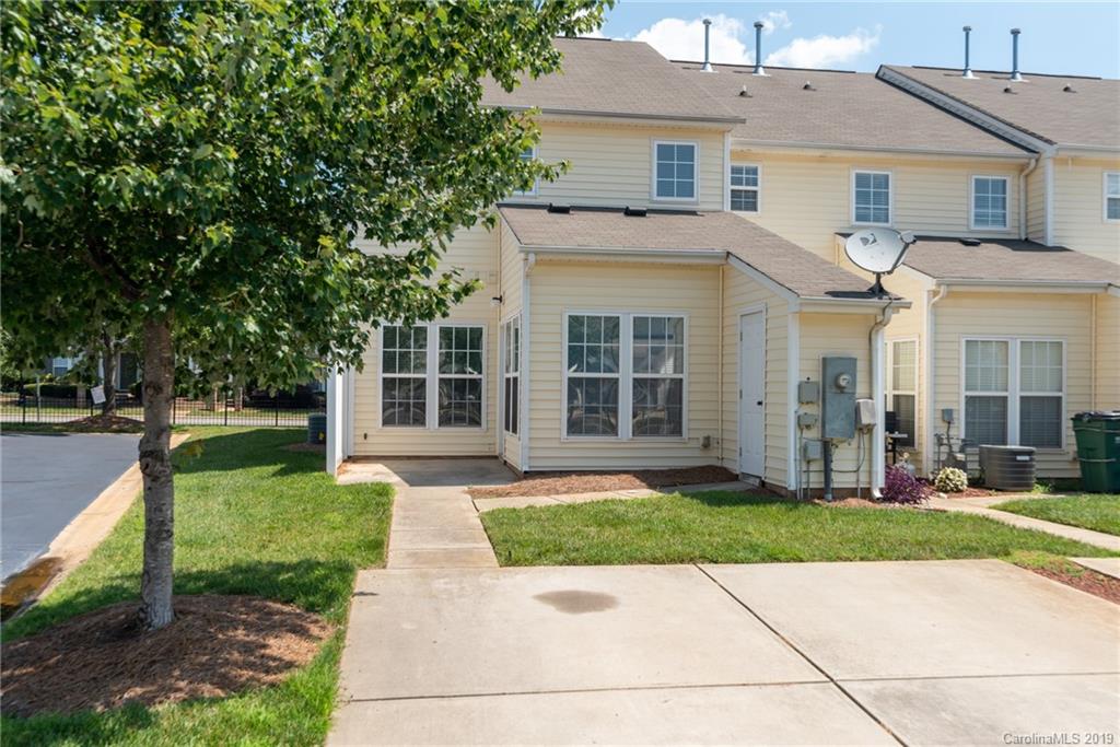 4854 Prosperity Ridge Road Charlotte, NC 28269 - Photo 20 of 22 a front view of a house with a yard