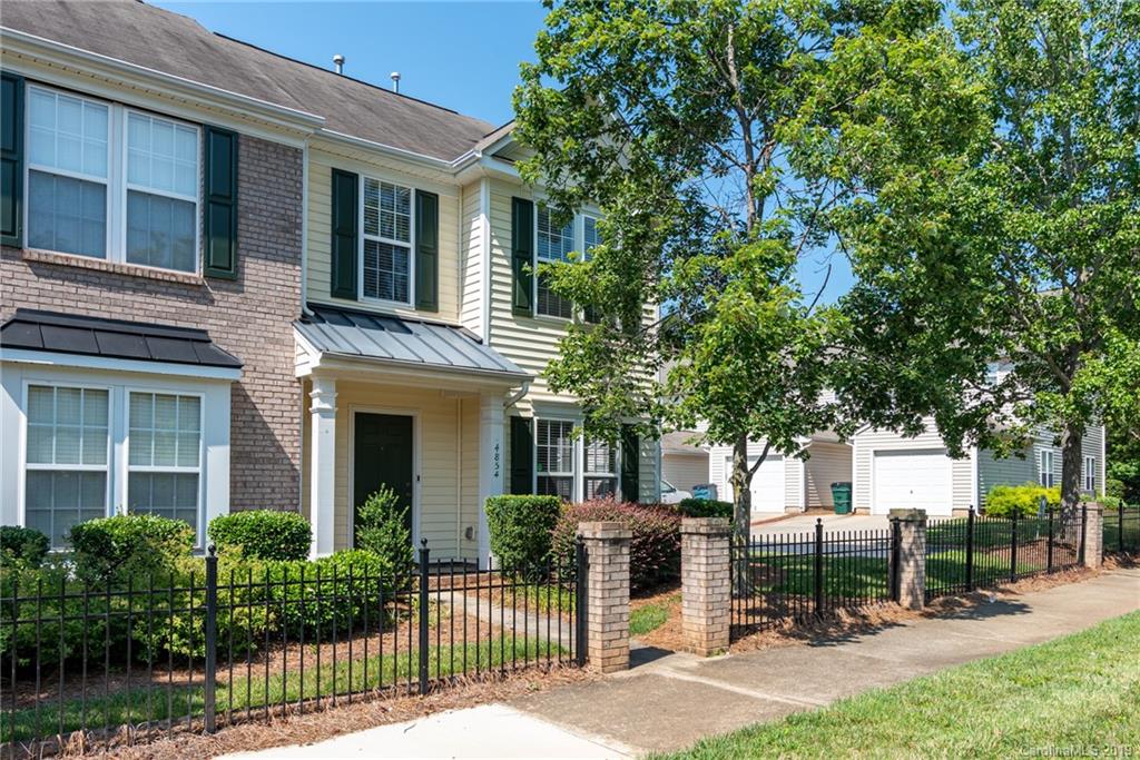 4854 Prosperity Ridge Road Charlotte, NC 28269 - Photo 22 of 22 a view of a house with sitting area and garden