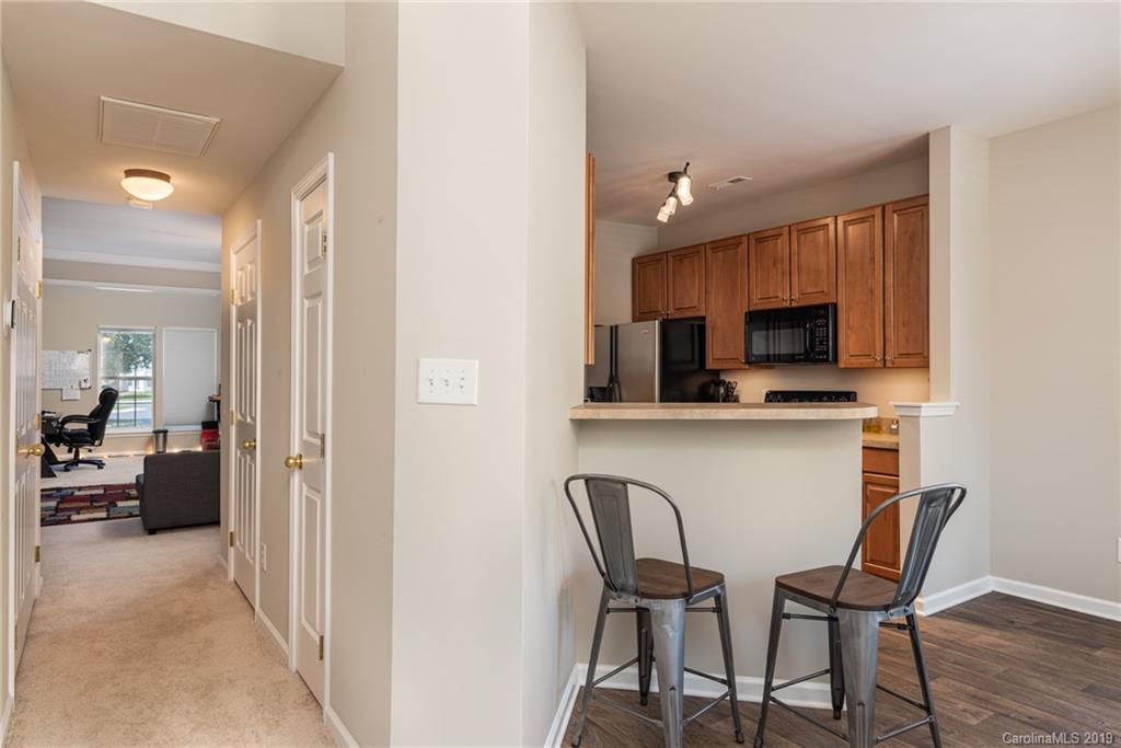 4854 Prosperity Ridge Road Charlotte, NC 28269 - Photo 5 of 22 a view of a dining room with furniture and wooden floor