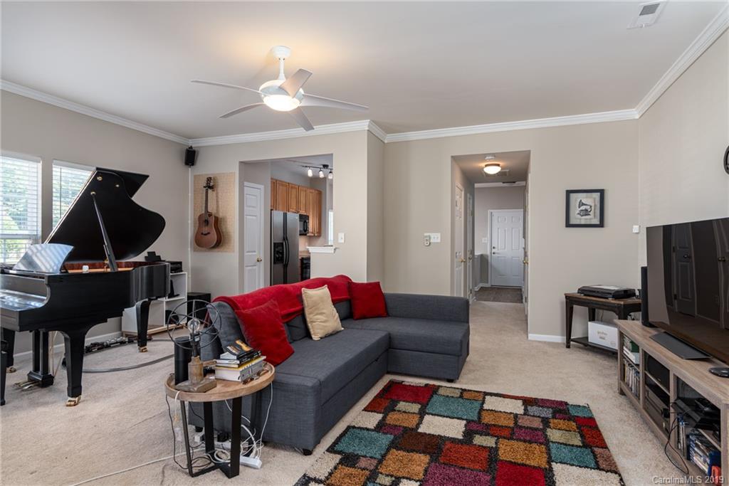 4854 Prosperity Ridge Road Charlotte, NC 28269 - Photo 9 of 22 a living room with furniture and a flat screen tv