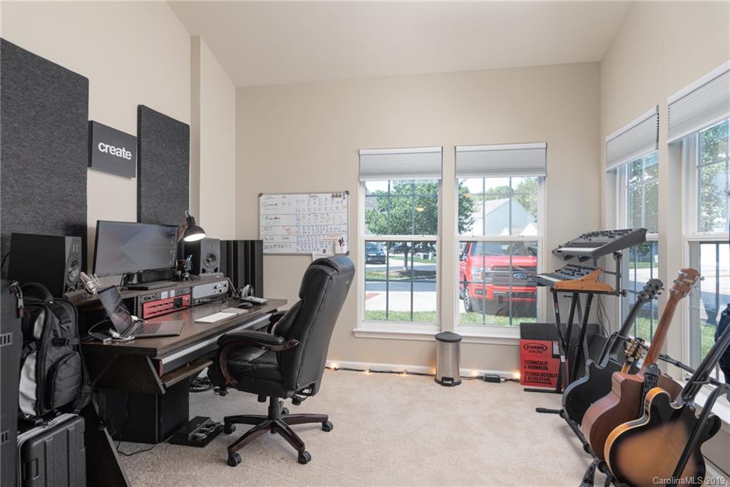 4854 Prosperity Ridge Road Charlotte, NC 28269 - Photo 10 of 22 a view of a workspace with furniture and a window