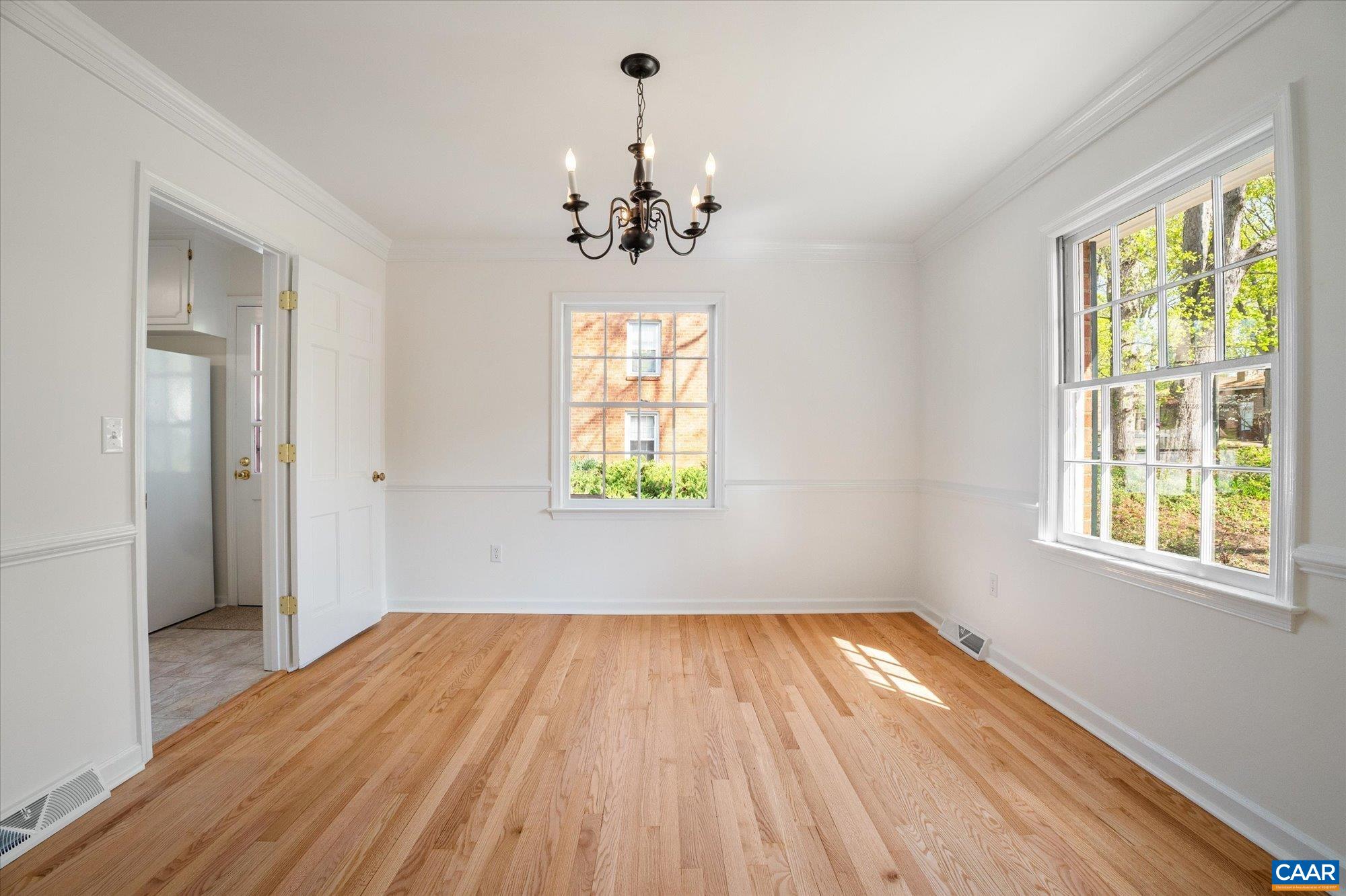 503 Carrsbrook Drive Charlottesville, VA 22901 - Photo 12 of 58 a view of empty room with wooden floor and fan