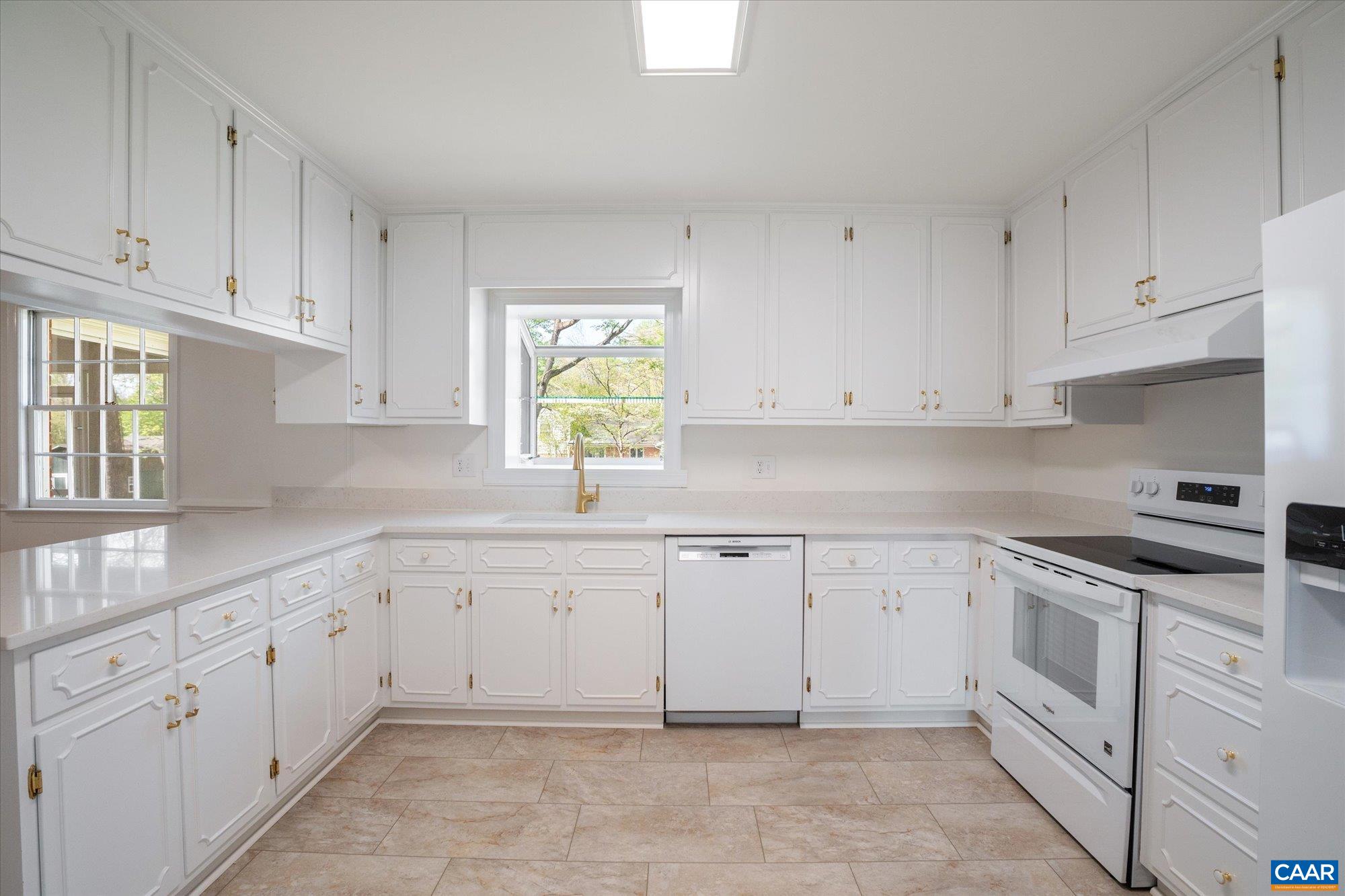 503 Carrsbrook Drive Charlottesville, VA 22901 - Photo 20 of 58 a kitchen with white cabinets appliances and a sink