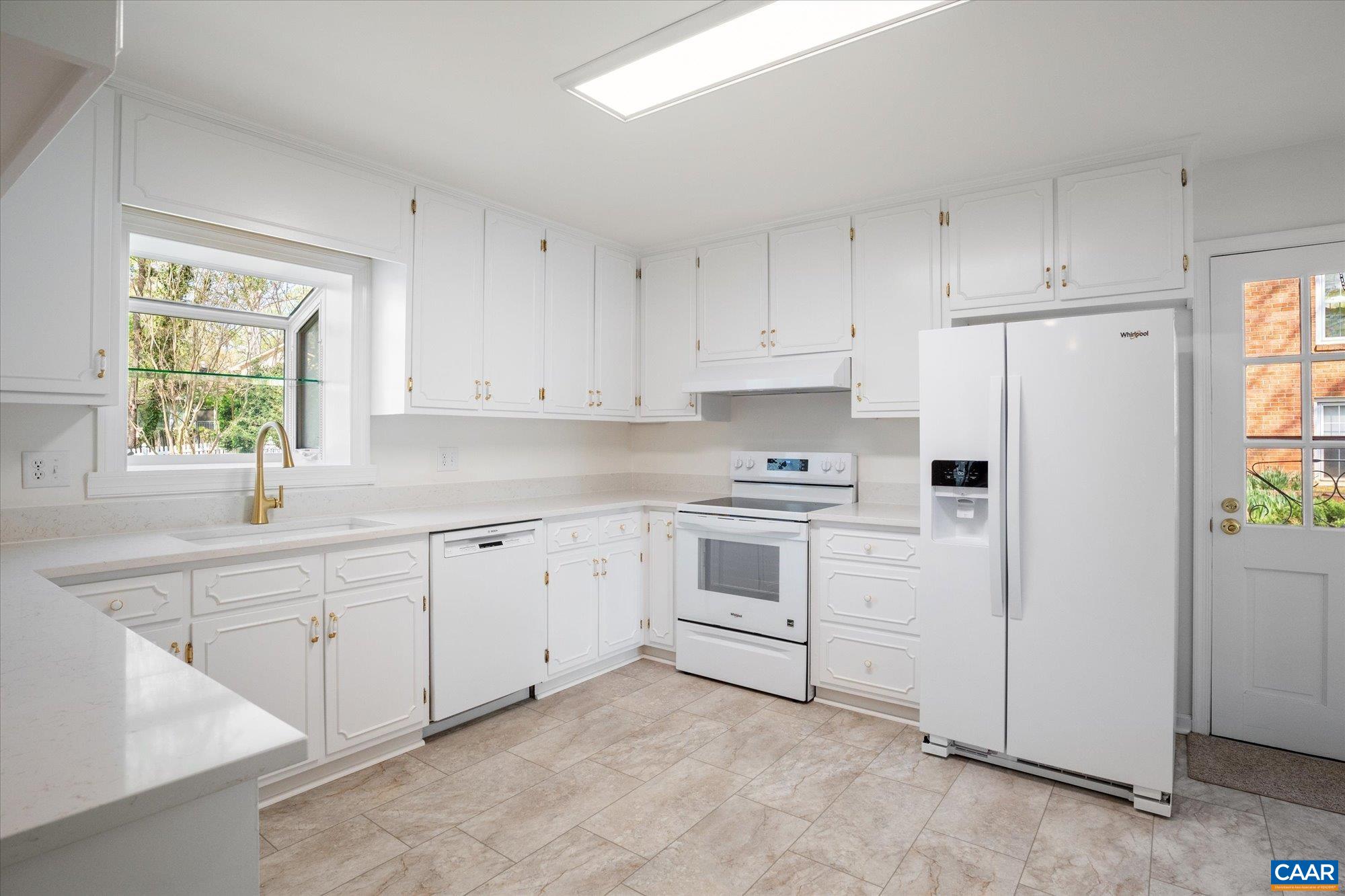 503 Carrsbrook Drive Charlottesville, VA 22901 - Photo 22 of 58 a kitchen with white cabinets and white appliances