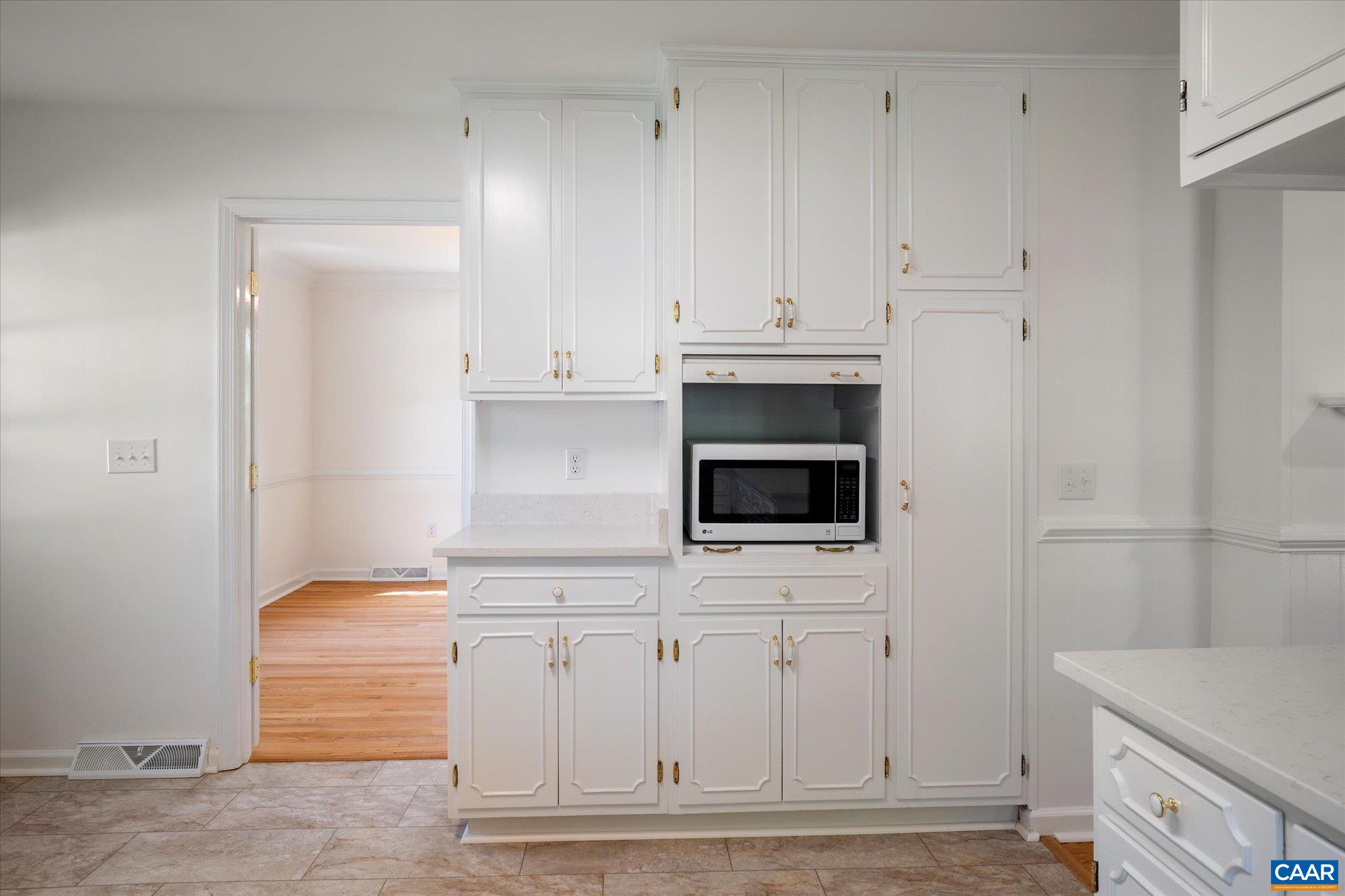 503 Carrsbrook Drive Charlottesville, VA 22901 - Photo 23 of 58 a kitchen with white cabinets and sink