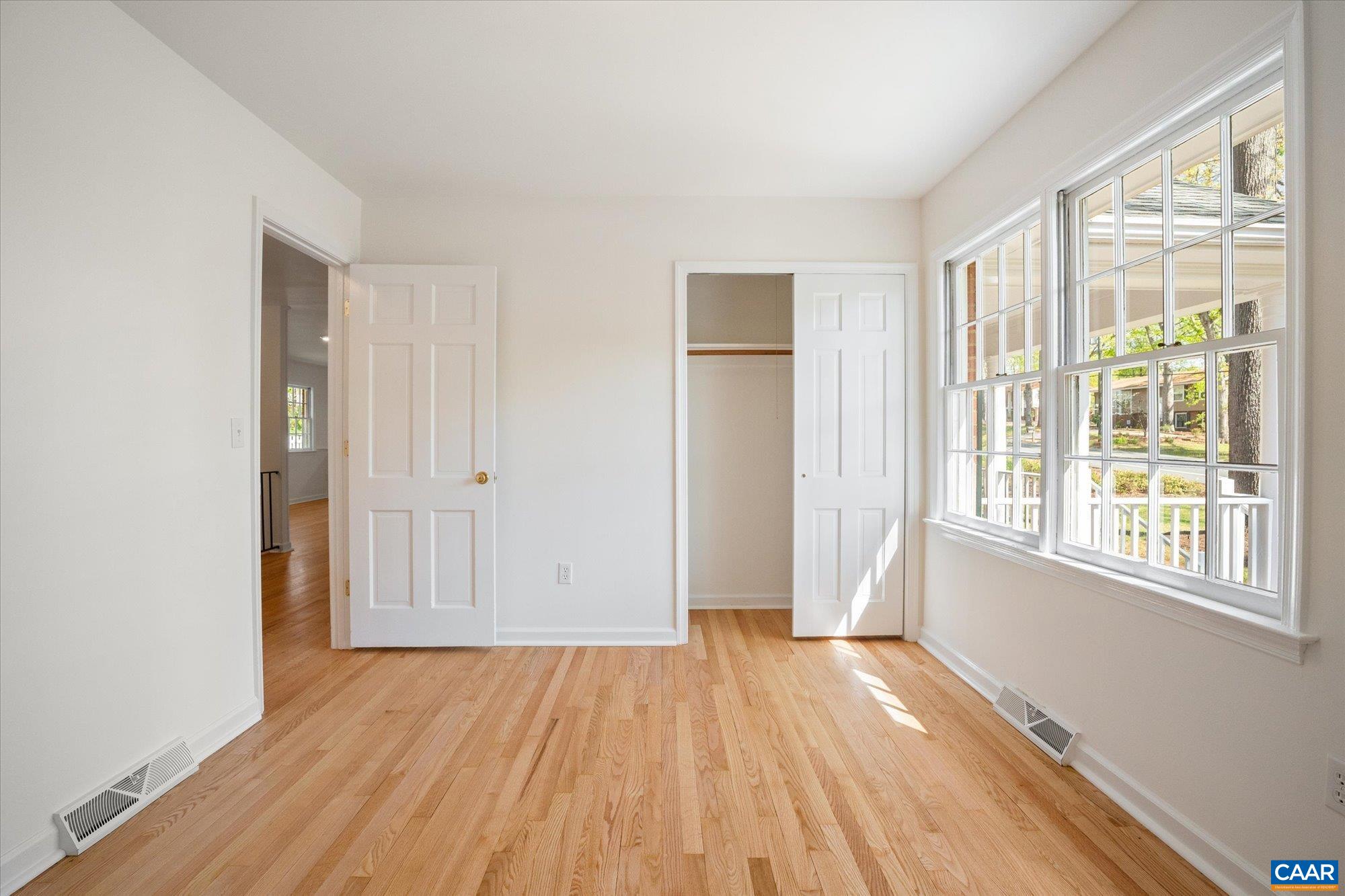 503 Carrsbrook Drive Charlottesville, VA 22901 - Photo 25 of 58 a view of empty room with wooden floor and fan