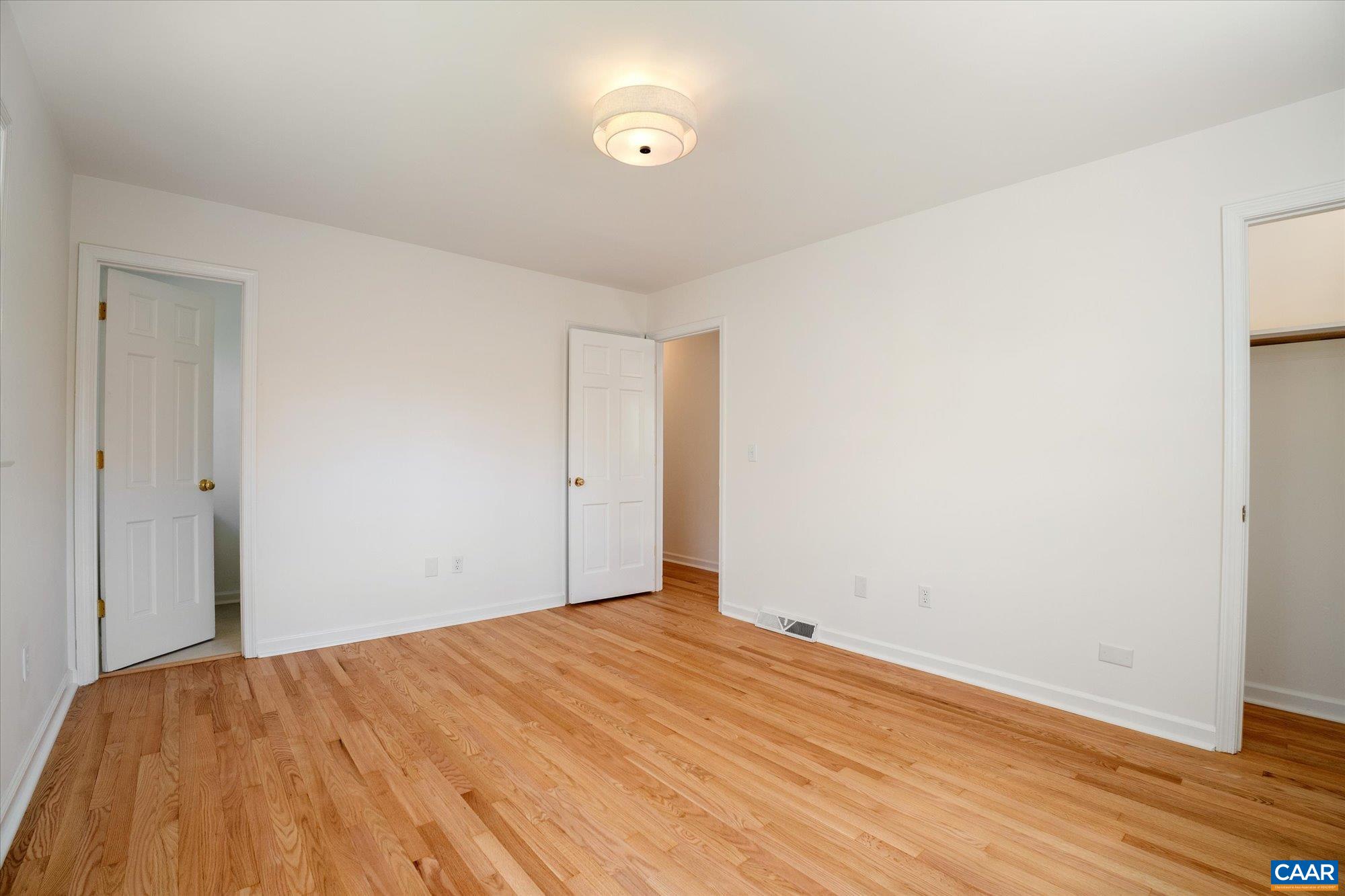 503 Carrsbrook Drive Charlottesville, VA 22901 - Photo 28 of 58 a view of empty room with wooden floor
