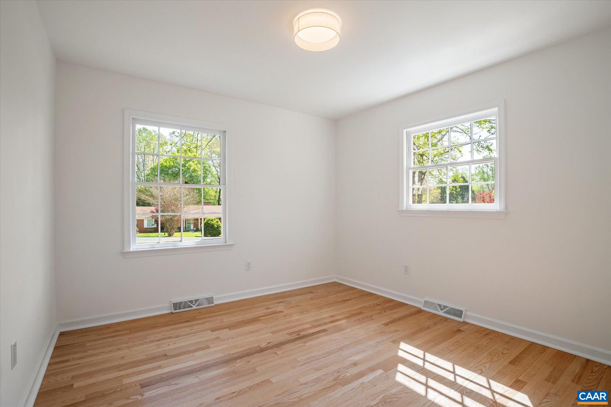 503 Carrsbrook Drive Charlottesville, VA 22901 - Photo 30 of 58 a view of empty room with wooden floor and fan
