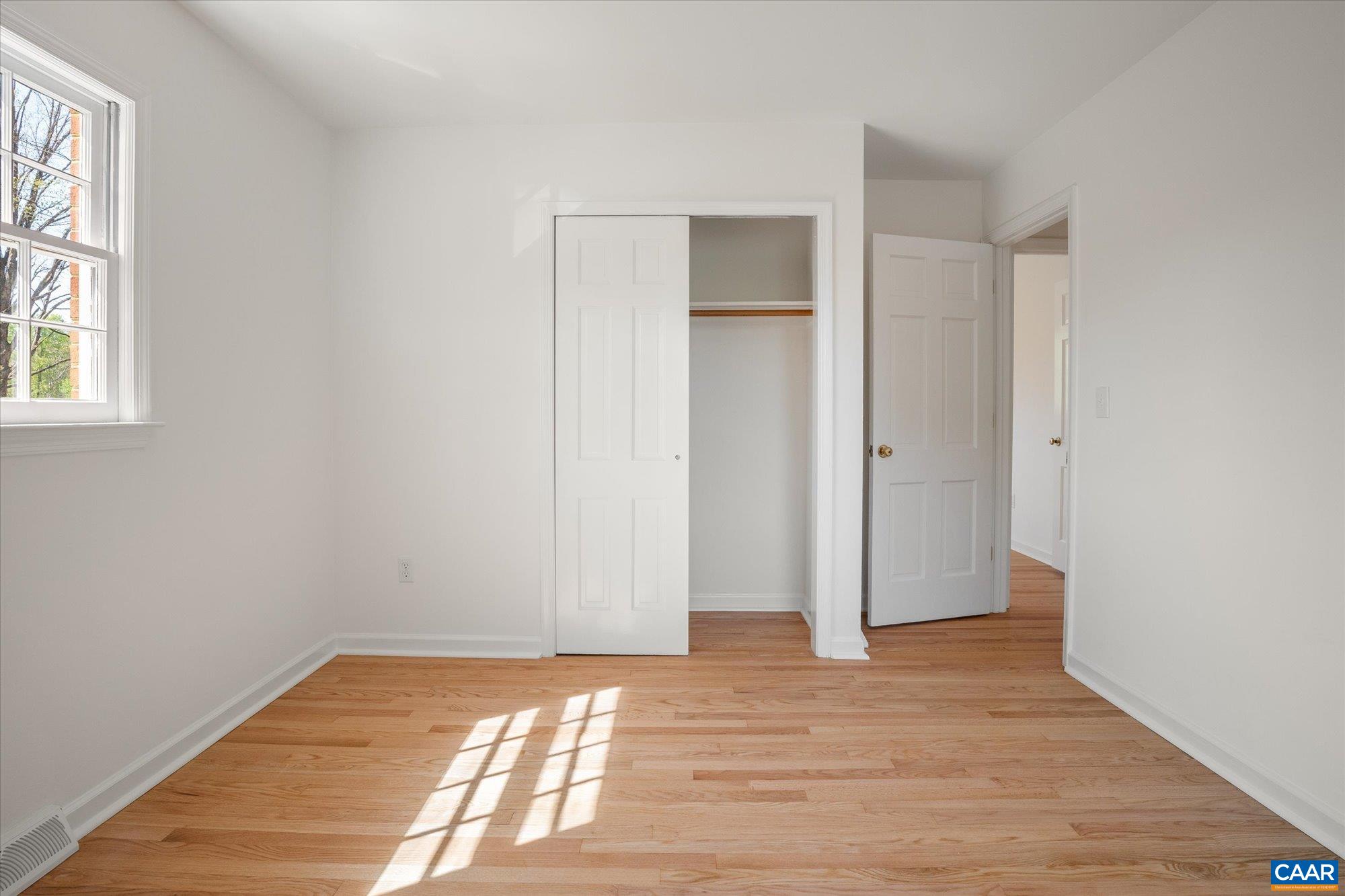 503 Carrsbrook Drive Charlottesville, VA 22901 - Photo 31 of 58 a view of empty room with wooden floor and fan